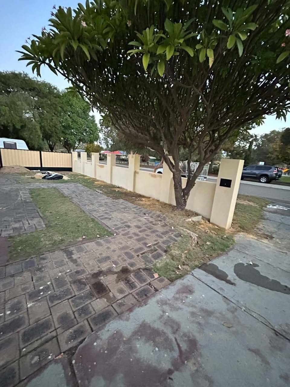 Cream sand finish fence by SKC Plastering Perth