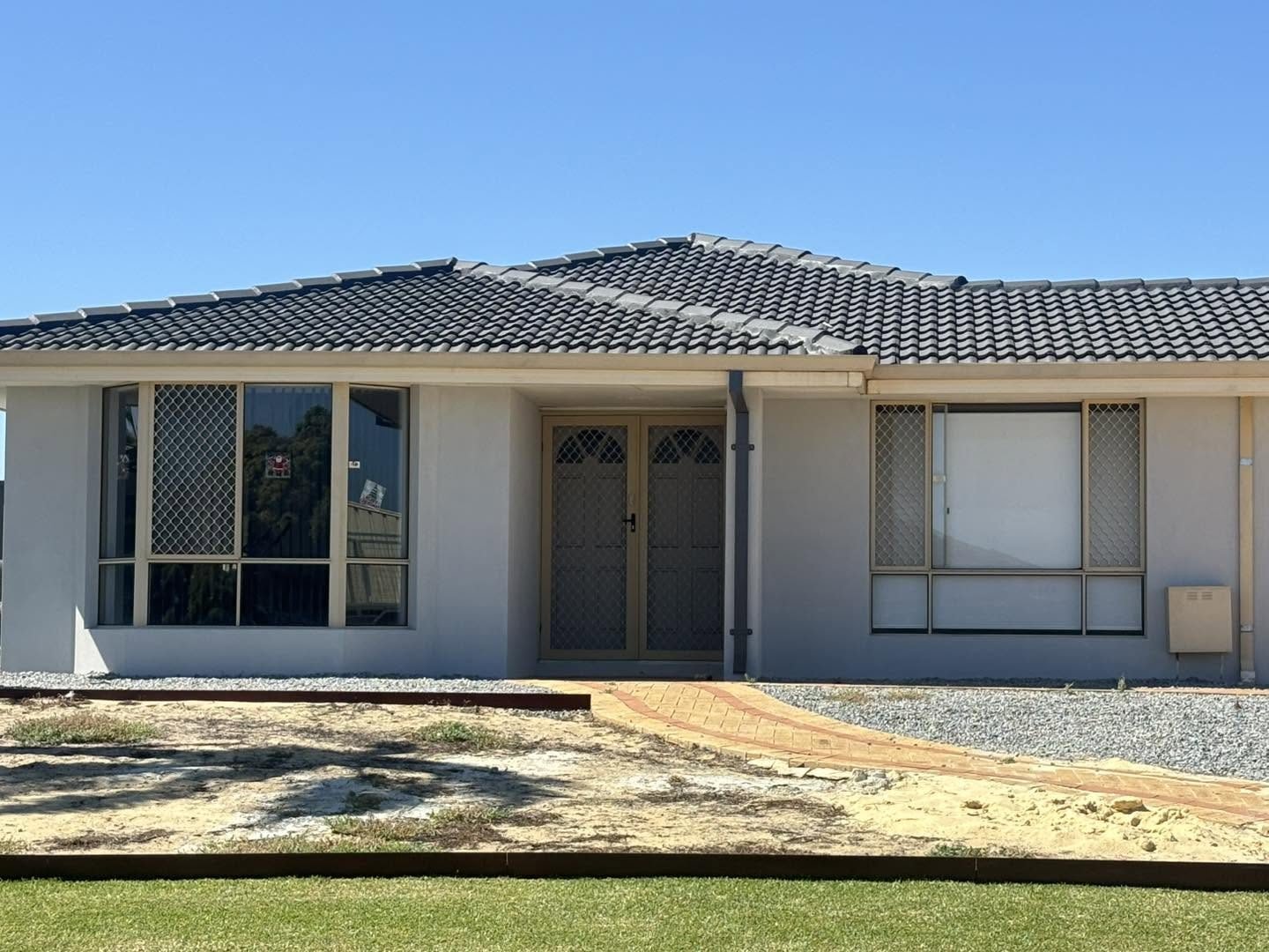 Plasterer skimming a smooth finish on an interior wall in Perth